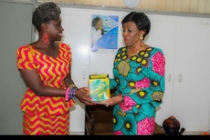 Akua presents a copy of her book to Nana Konadu Agyemang-Rawlings at her office