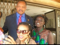 Akua chaperones VIPS visiting Ghana. Here she is with Rev. Jessie Jackson