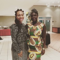 Akua in her trademark African fashion, making connections in Gambia. 